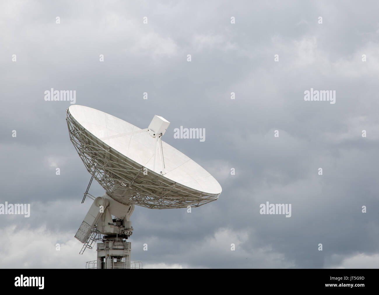 Radio telescope dish pointing at the sky Stock Photo