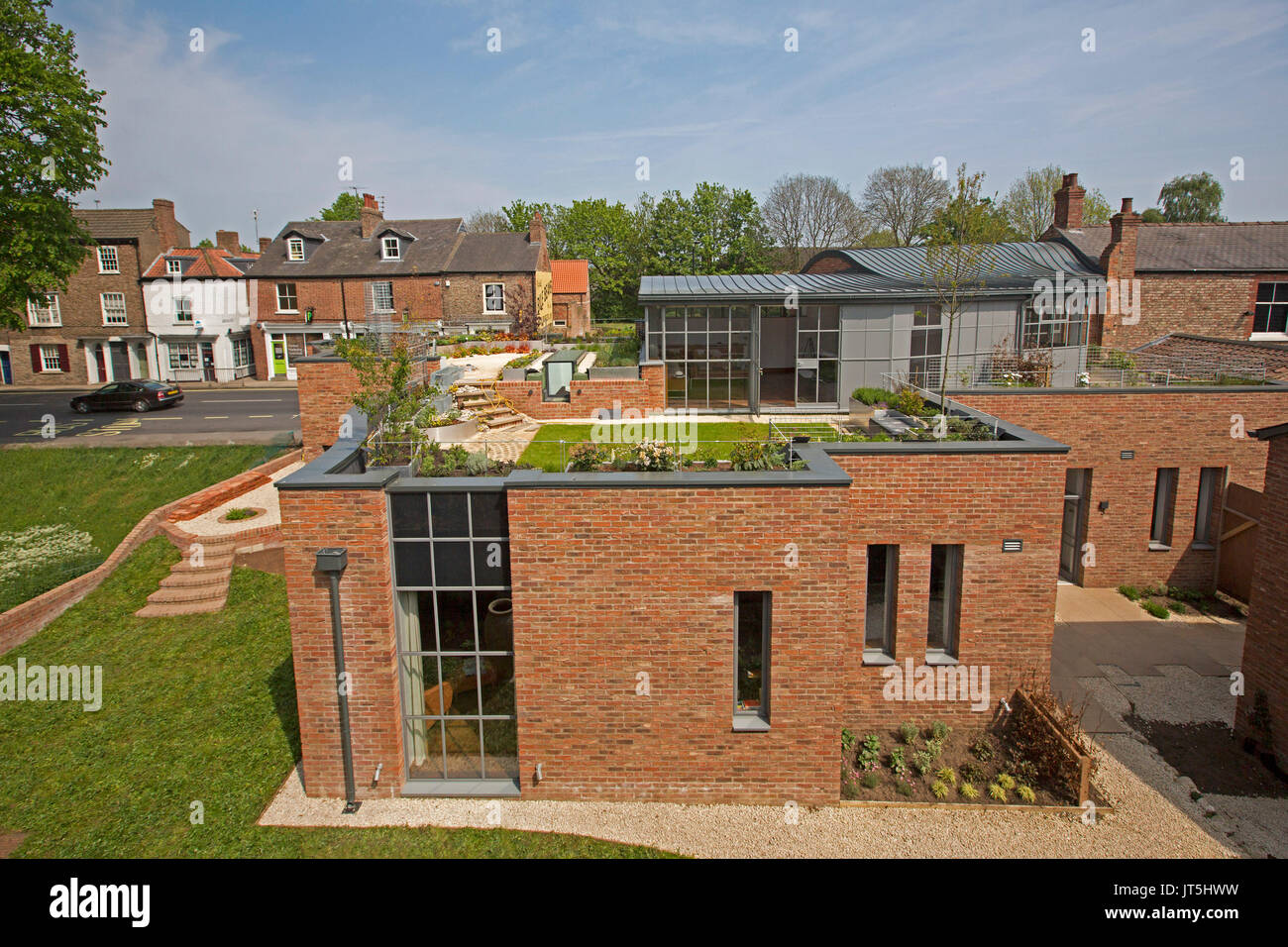 Red brick house with rooftop garden in York, England Stock Photo
