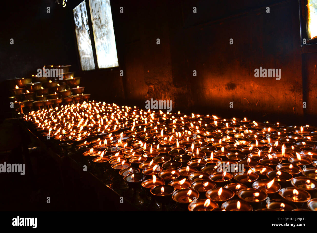 Prayer Candles burning within a Buddhist Temple Stock Photo Alamy