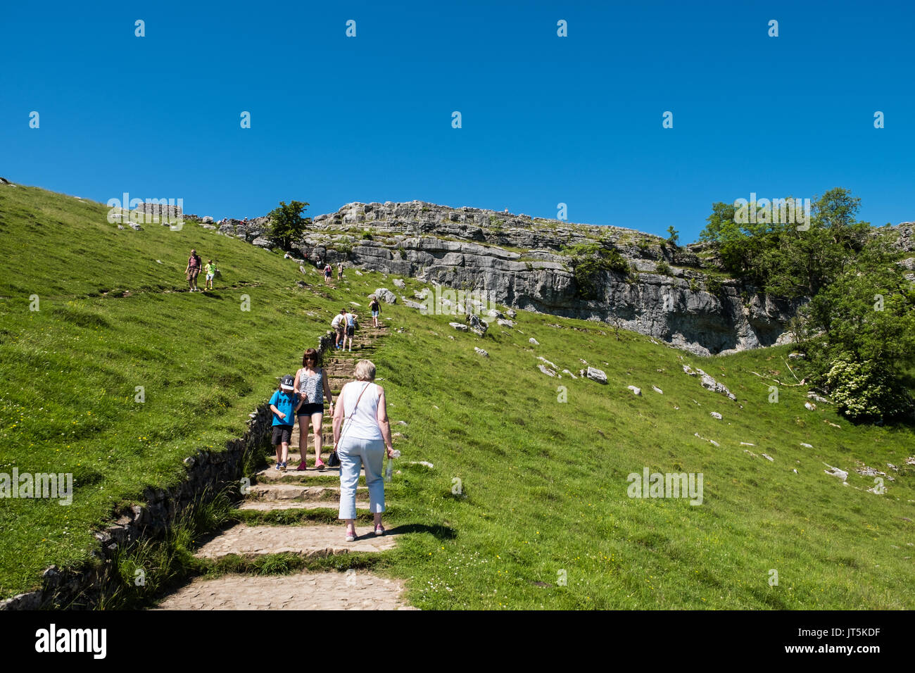 Climbing to the Top of Malham Cove. Stock Photo