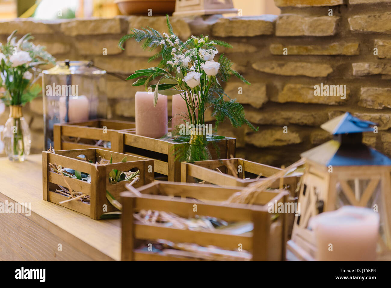 Wedding Decoration Of The Restaurant With Wooden Boxes And Flowers