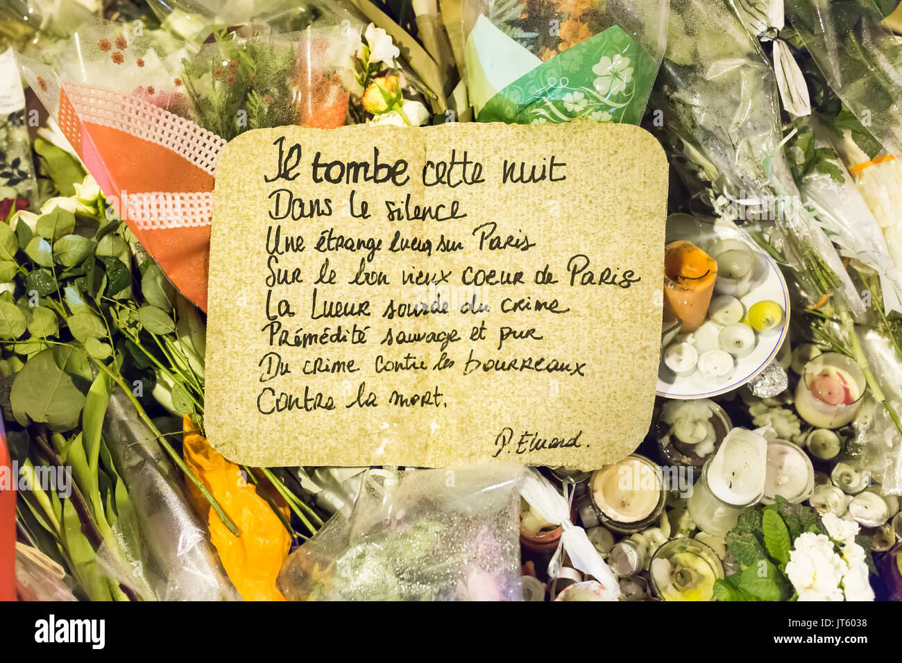 a poem of paul eluard, kill, tuer. Spontaneous homage at the victims of the terrorist attacks in Paris the 13th of november 2015: Stock Photo