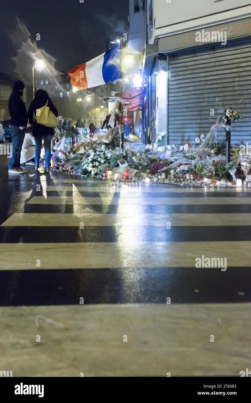 French flag flying in the night at the petit cambodge. Spontaneous homage at the victims of the terrorist attacks in Paris the 13th of november 2015 Stock Photo