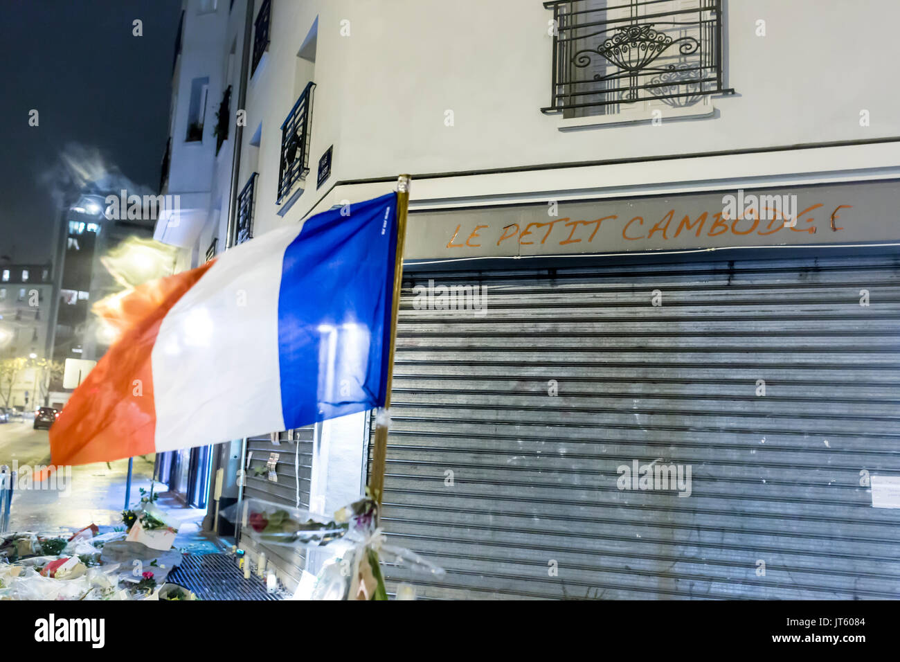 french flag at le petit cambodge. Spontaneous homage at the victims of the terrorist attacks in Paris the 13th of november 2015. Stock Photo