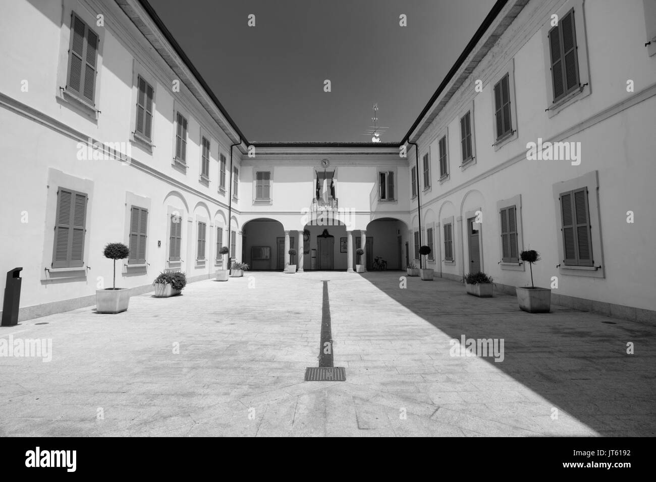 Cassano d'Adda (Milan, Lombardy, Italy): exterior of the historic building hosting the town hall. Black and white Stock Photo