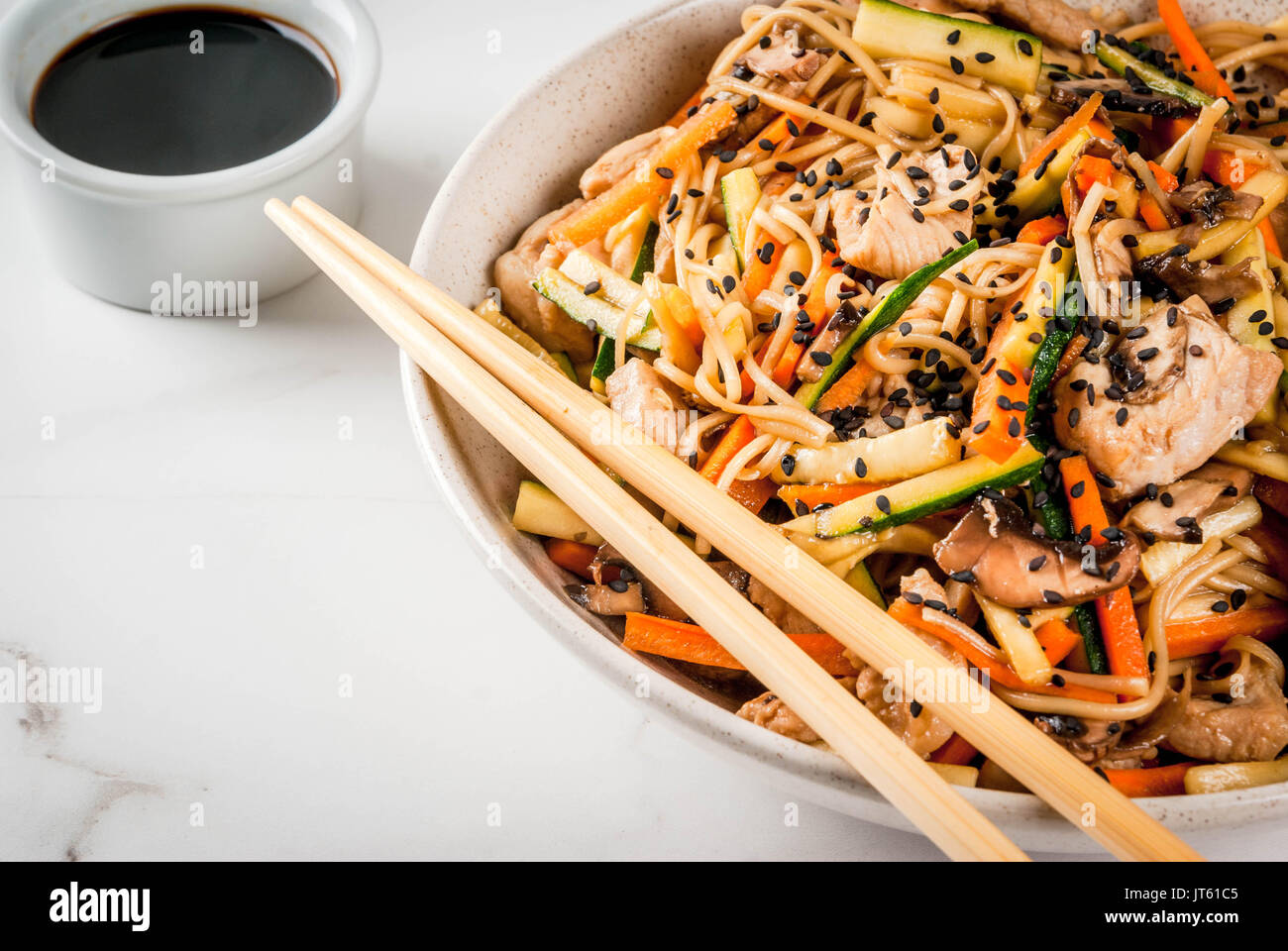 Traditional Asian Food Lunch Stirfry Rice Noodles Zucchini Carrots Bamboo Mushrooms Pork Beef Soy Sauce And Black Sesame With Soy Sauce Ch Stock Photo Alamy