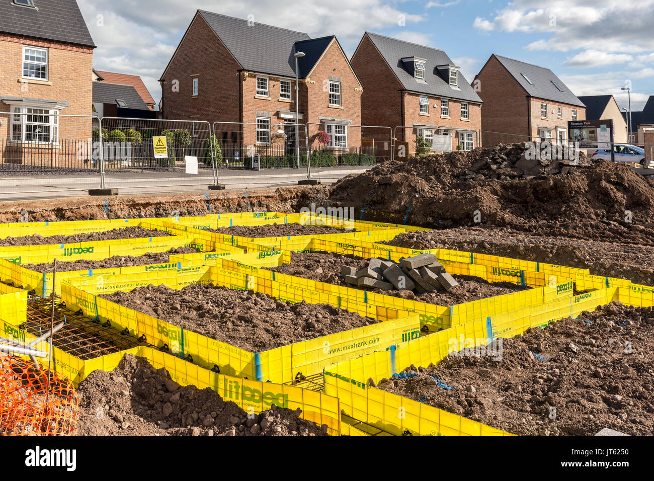 Newbuild houses on new estate with footings marked out for new house