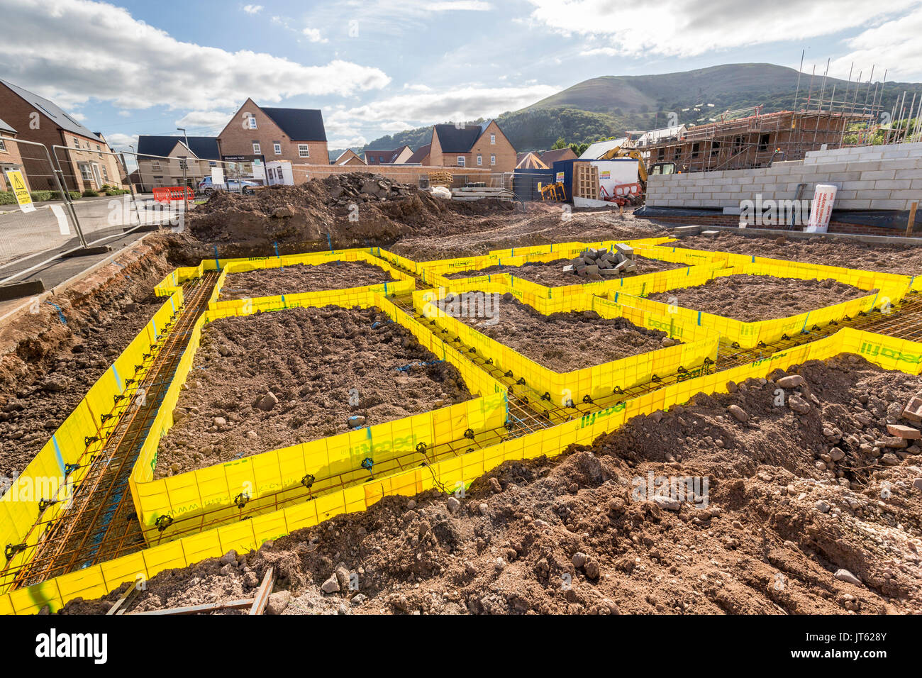 Newbuild houses on new estate with footings marked out for new house, Llanfoist, Abergavenny, UK Stock Photo