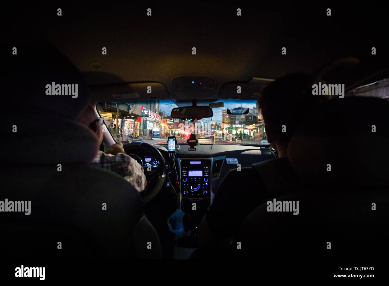 NEW YORK, USA - October 13, 2016. Back Seat View of a Passenger using a Lyft Taxi to go from Manhattan to Brooklyn Stock Photo