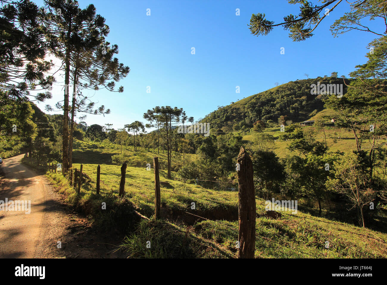 Landscape of dirt road in direction of city Goncalves. Minas Gerais State - Brazil Stock Photo