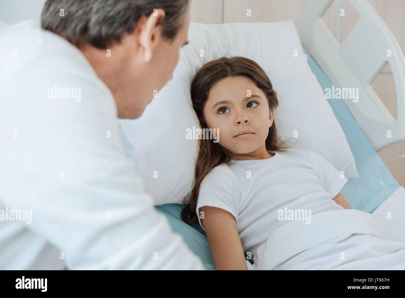 Cute young girl looking at her father Stock Photo