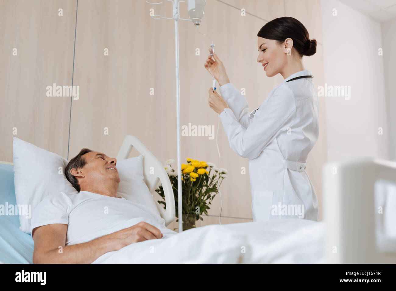 Cheerful experienced therapist interacting with her patient Stock Photo