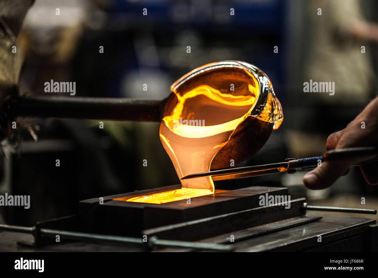 Pouring Melted Glass into Graphite Mold in Stock Photo Alamy