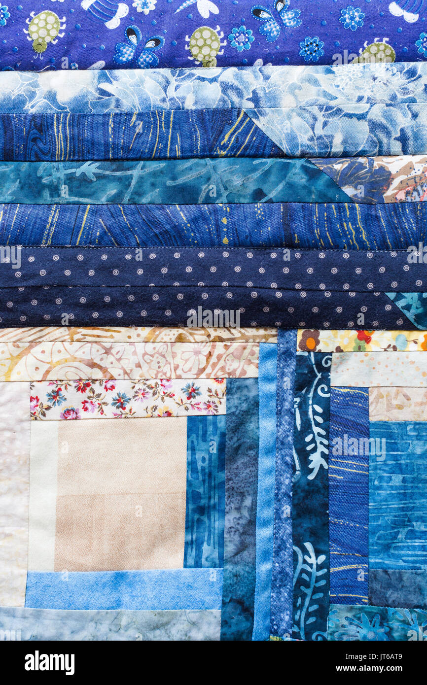 garment manufacturing, sewing, creativity, handiwork, decoration, arts and crafts cocnept - textile applique made of different in forms and colores patches with various nice patterns Stock Photo