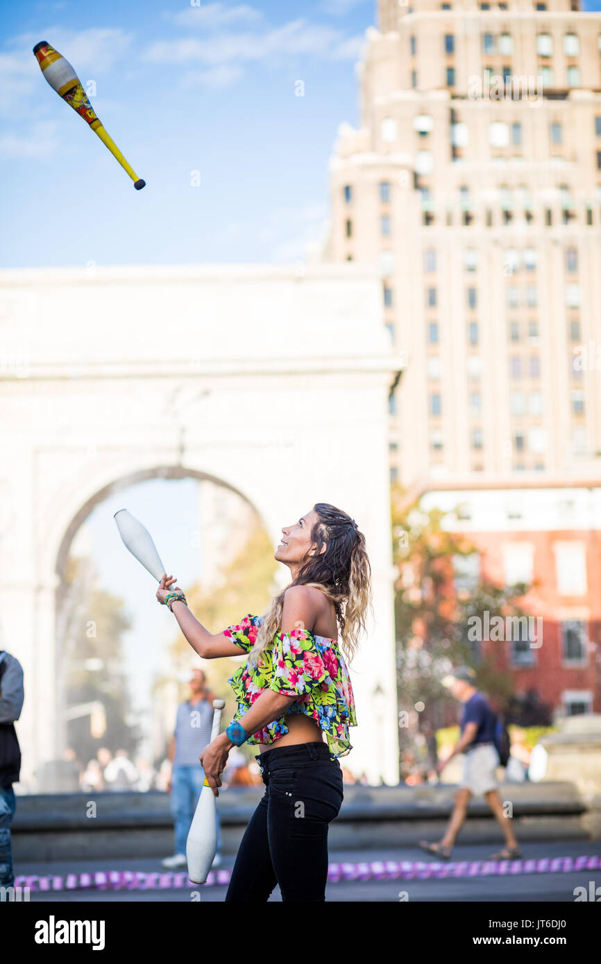 NEW YORK, USA October 17, 2016. Woman Juggling with Pins, in the Middle of Washington Square