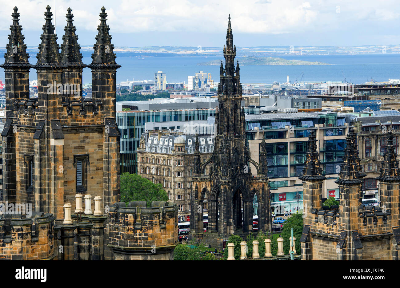 Assembly halls spires in the left foreground and the top of the Scott Monument (centre) Edinburgh. Stock Photo