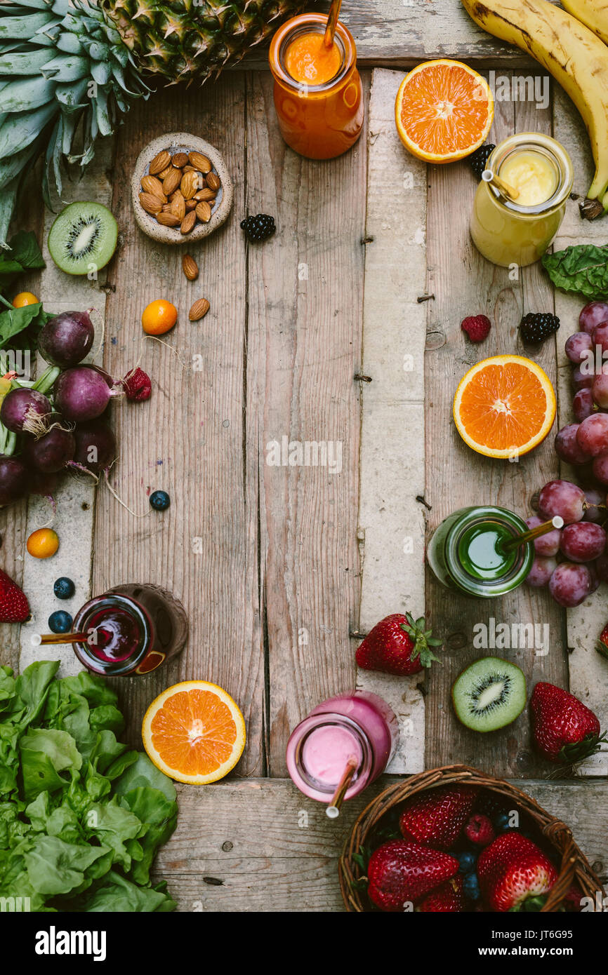 Smoothies and Fruits on Wood Stock Photo