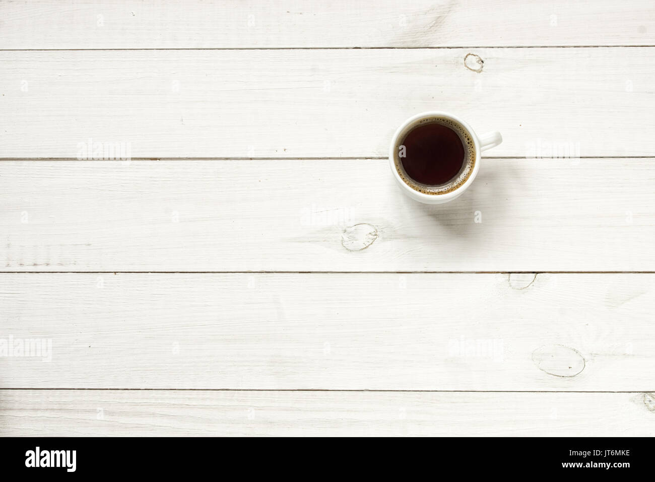 Coffee cup on wood table top view Stock Photo