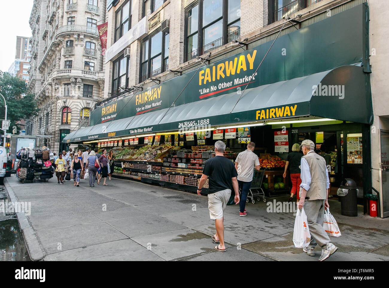 People walk by Fairway supermarket on Broadway. Stock Photo