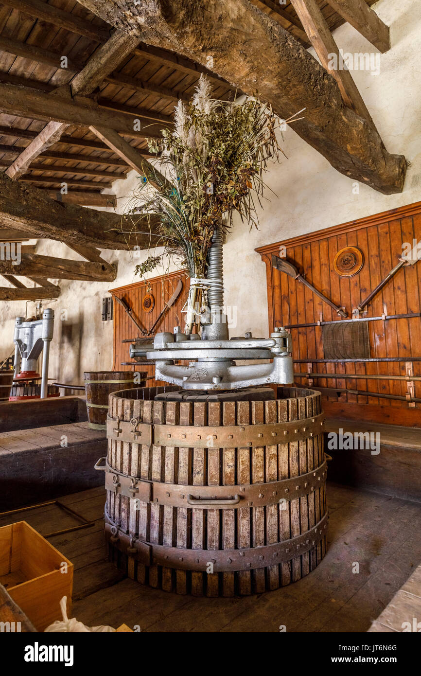 Traditional old-fashioned wine press on display at Chateau de Myrat, Sauternes appellation estate, Barsac, Gironde, Graves region, southwest France Stock Photo