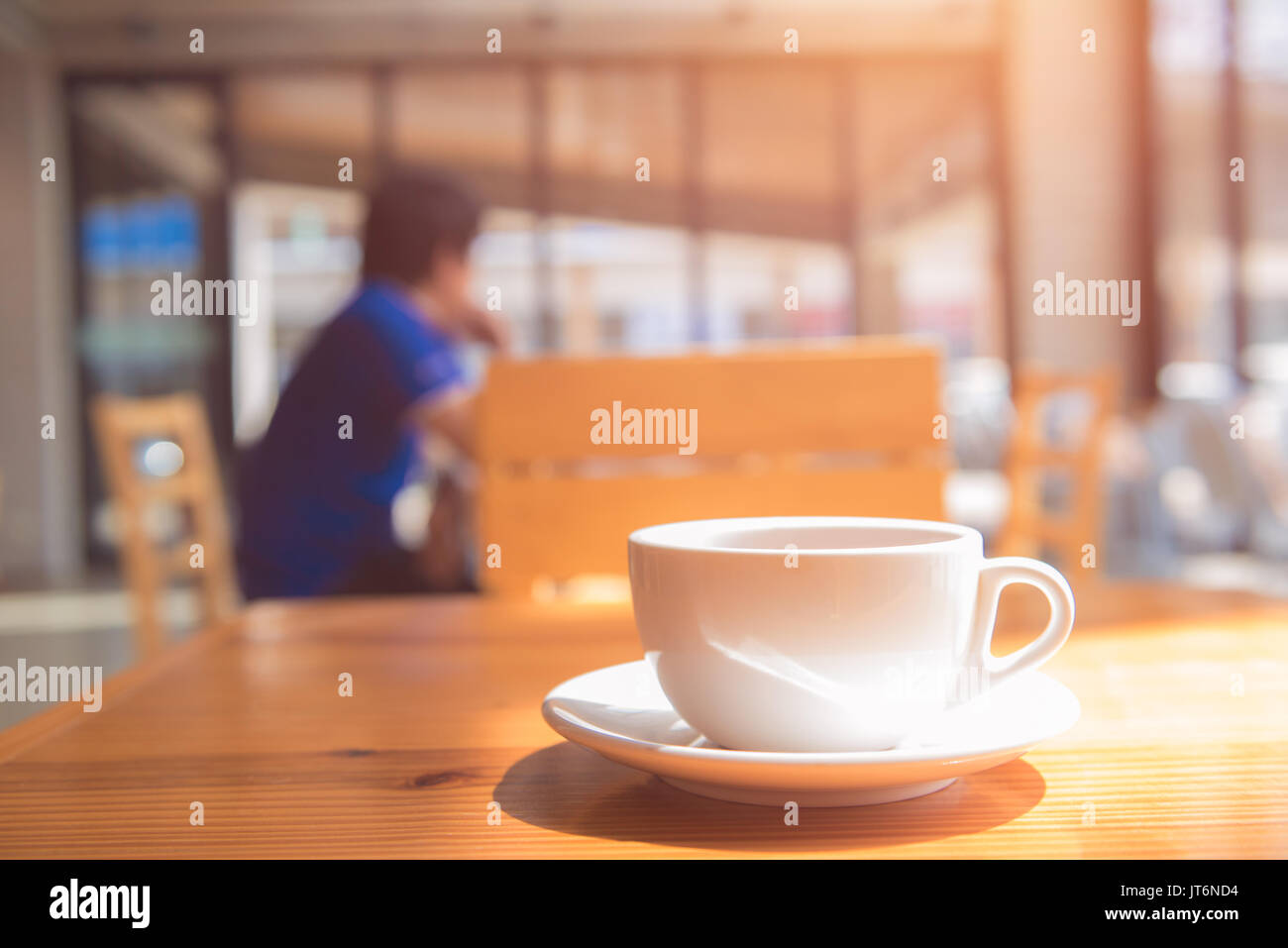 morning a cup tea or coffee on wooden table in coffee shop Stock Photo