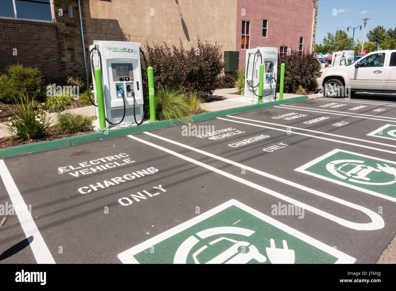 EV Electric Vehicle Charging Stations and parking spots at the front of