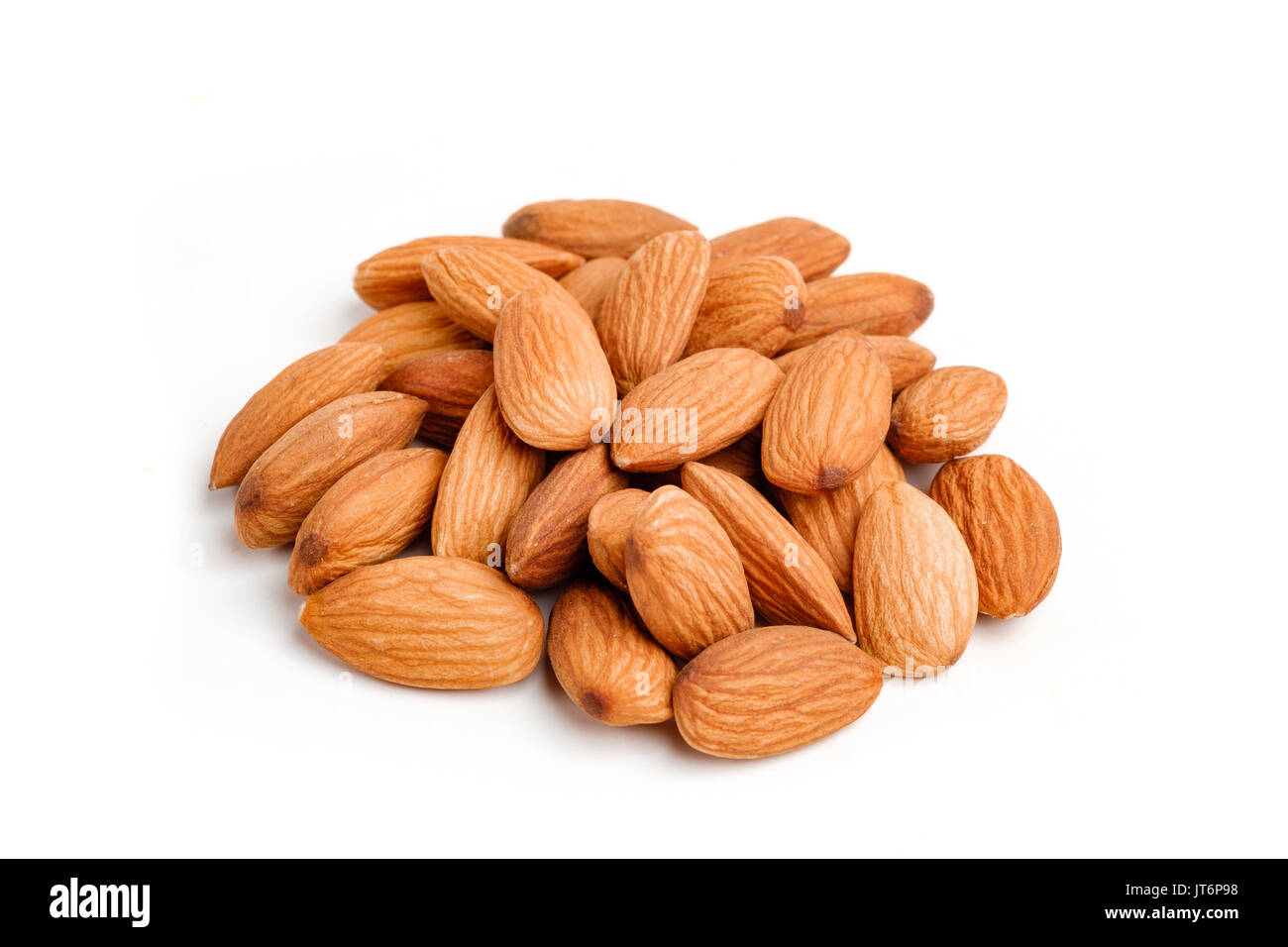 Almond nuts on isolated white background Stock Photo