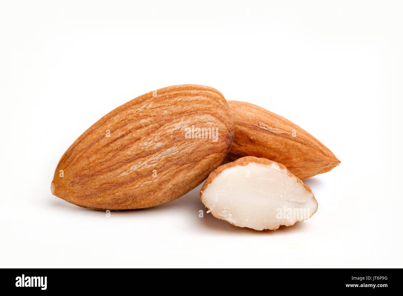 Almond nuts on isolated white background Stock Photo