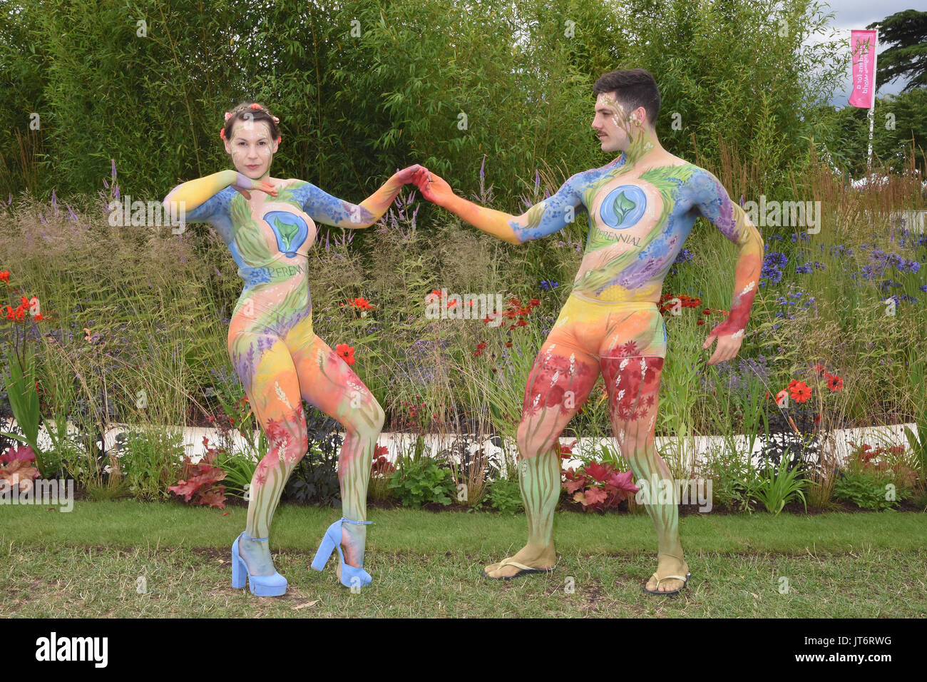 Female and Male Models painted by artist Carolyn Roper. The Perennial Garden. RHS Hampton Court Palace Flower Show. East Molesey, Surrey. UK 03.07.17 Stock Photo