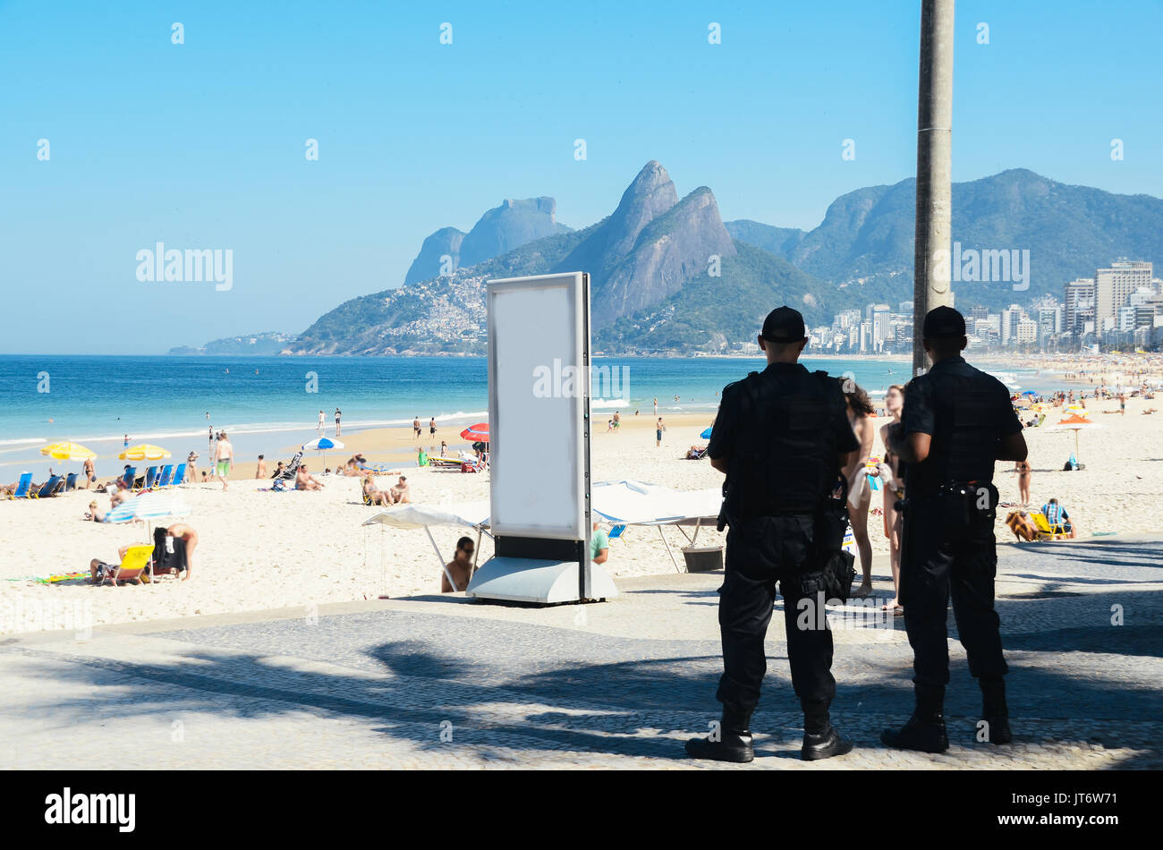 Police watch over tourists in Rio de Janeiro, Brazil. Rio is a popular tourist city but also experiences high levels of crime Stock Photo