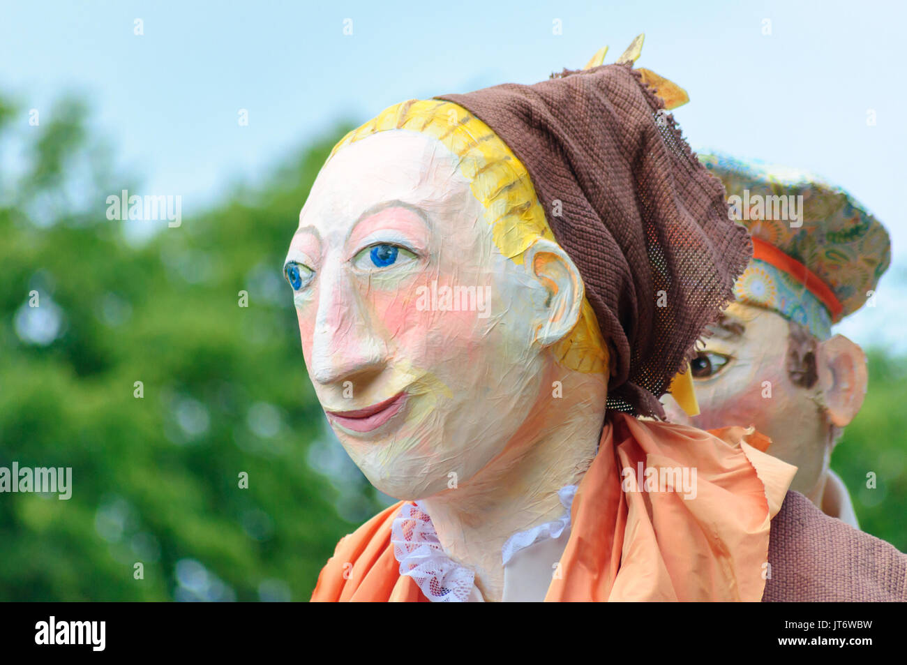 Participants dressed in a giant puppet costume celebrating Sma Shot Day on the streets of