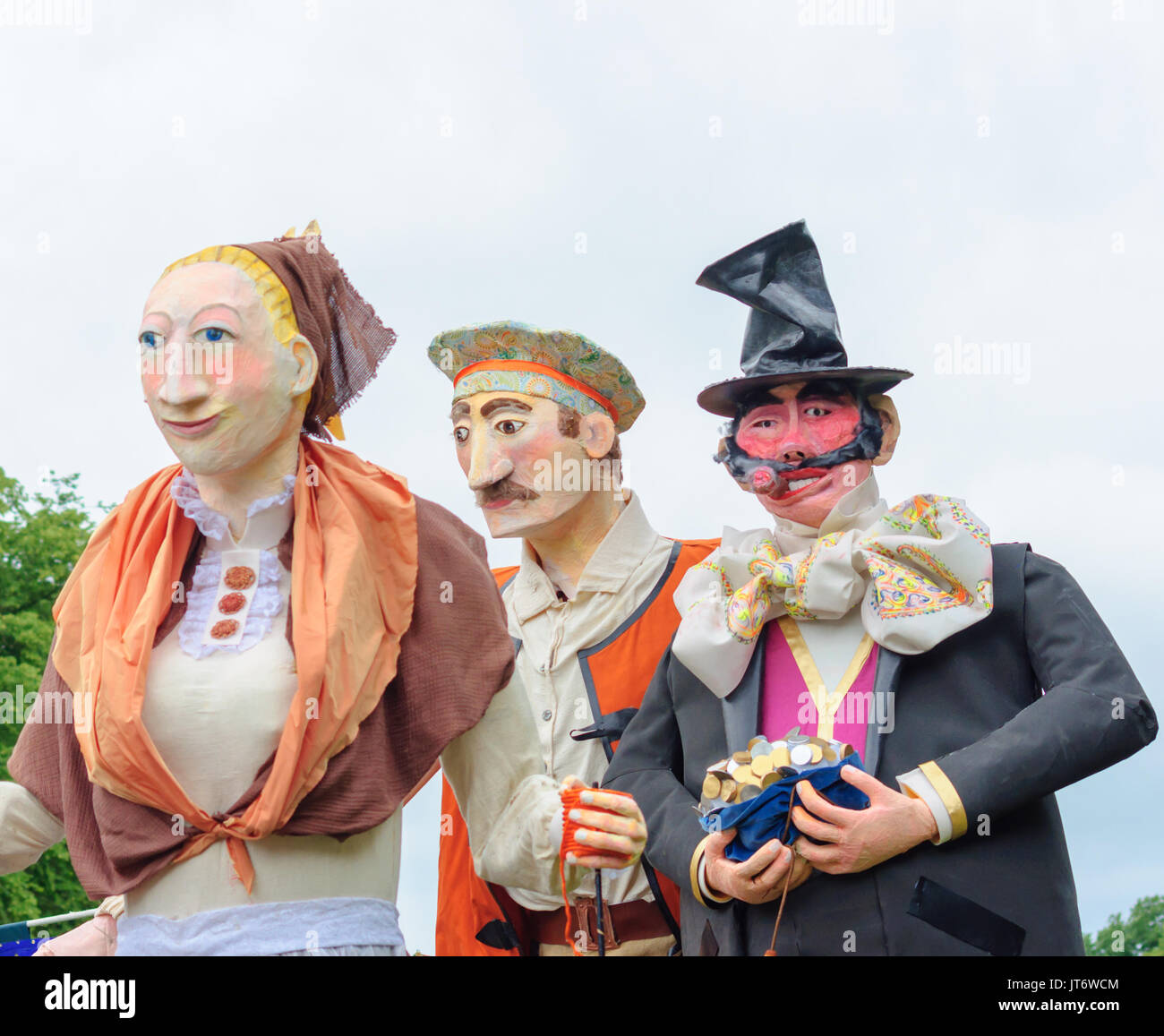 Participants dressed in a giant puppet costume celebrating Sma Shot Day on the streets of