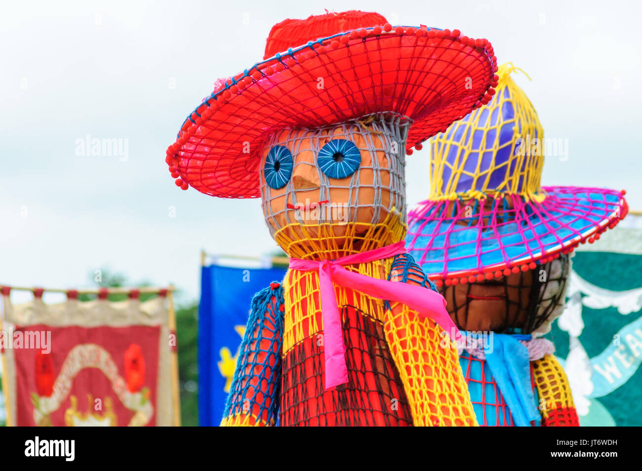 Participants dressed in a giant puppet costume celebrating Sma Shot Day on the streets of