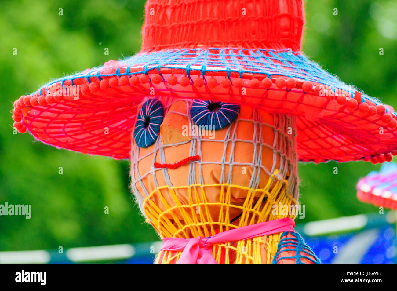 Participants dressed in a giant puppet costume celebrating Sma Shot Day on the streets of