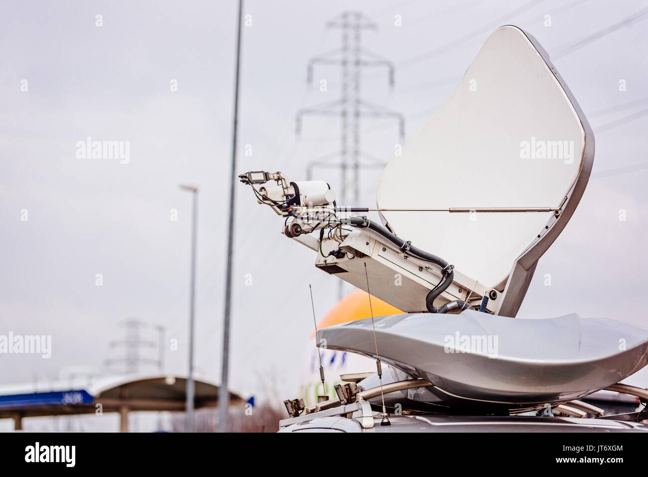Satellite dish antenna mounted on television broadcasting van Stock