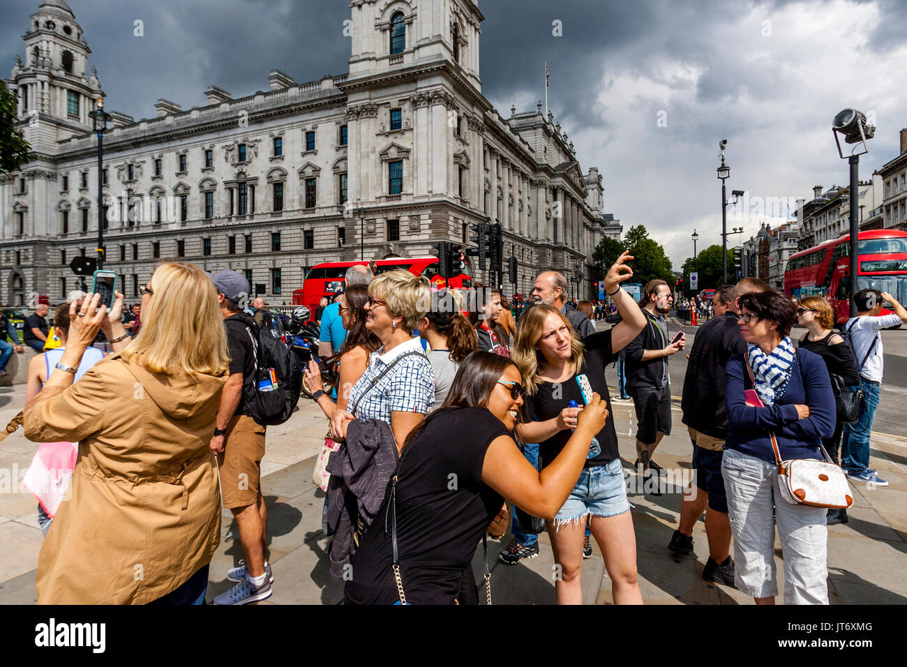 Tourists Taking Photographs, Westminster, London, UK Stock Photo