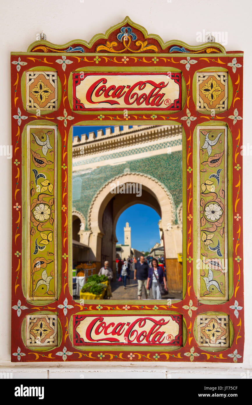Street life scene. Bab Bou Jeloud gate reflected in a mirror, main entrance to Souk Medina of Fez, Fes el Bali. Morocco, Maghreb North Africa Stock Photo