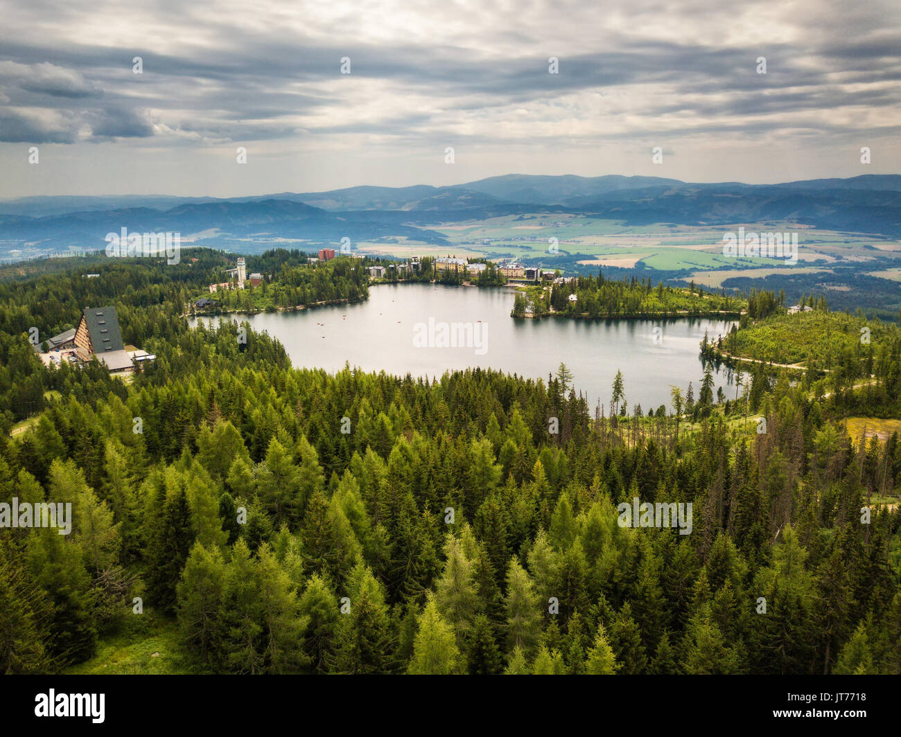 Glacial mountain lake Strbske Pleso in National Park High Tatras in Slovakia viewed from the olympic ski bridge Stock Photo