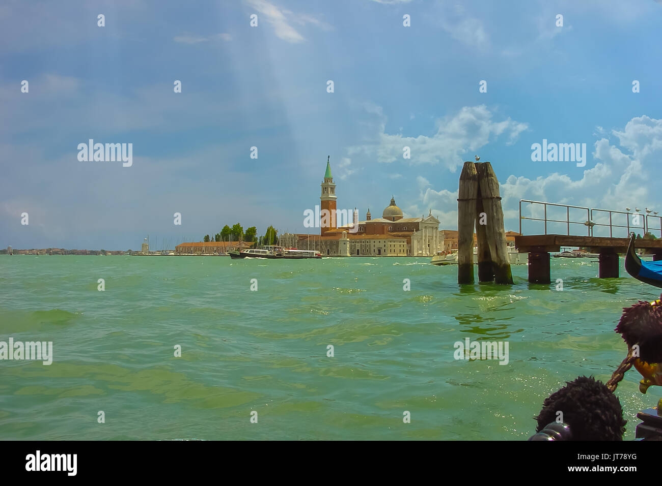 Church of San Giorgio Maggiore, Venezia Veneto Region, Italy taken from a gondola in the lagoon as the rays of sun hit the island Stock Photo