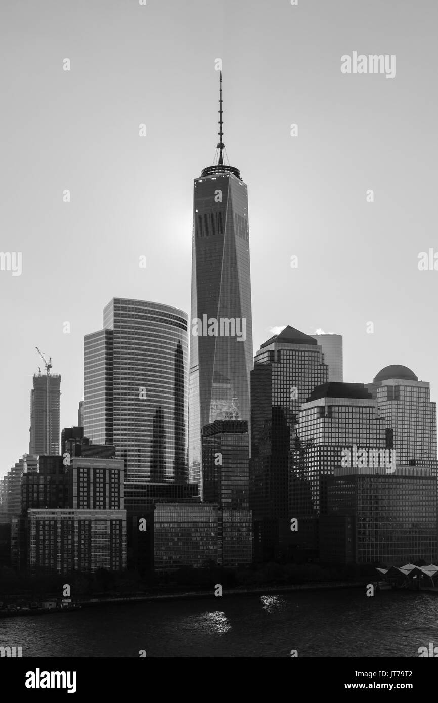 A black and white image of the Lower Manhattan skyline in New York City.  The One World Trade Centre dominates the skyline. Stock Photo