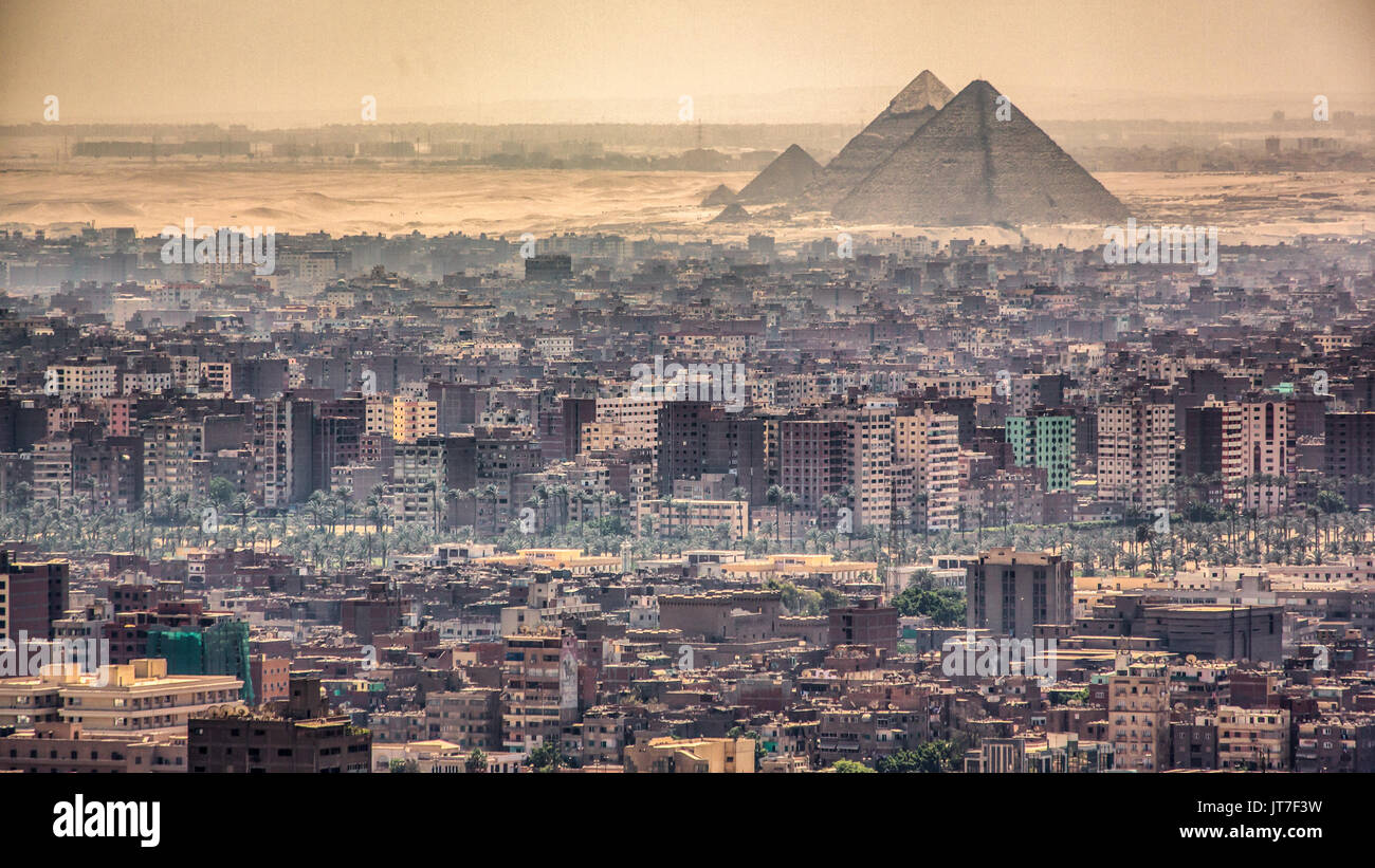 Aerial view of the city of Cairo with the Pyramids in the background