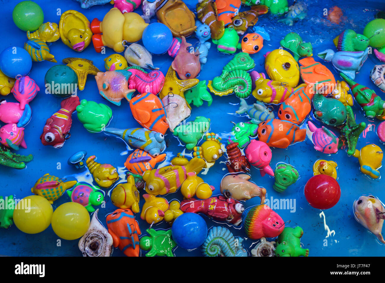 plastic toys floating in water, carnival game Stock Photo Alamy