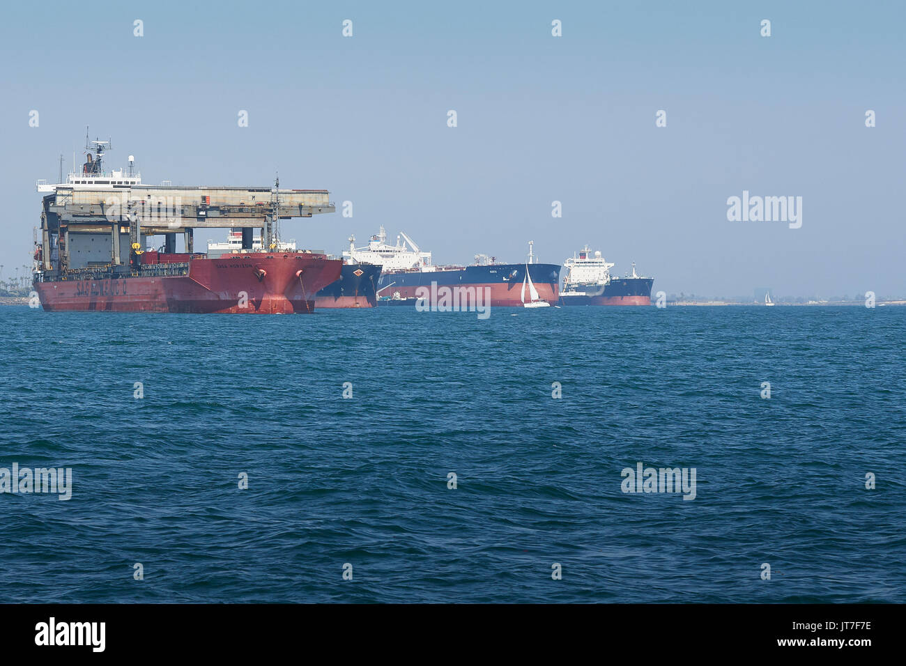 Specialist Open-Hatch Gantry Vessel, SAGA Horizon, With Other Cargo Ships, Anchored In The Port of Long Beach, California. Stock Photo