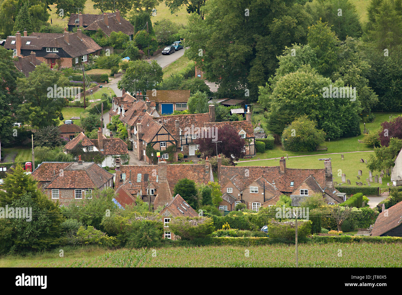 View over  the village of Turville in the English Chiltern hills  with  country cottages and St Mary's parish church  setting for the Vicar of Dibley Stock Photo
