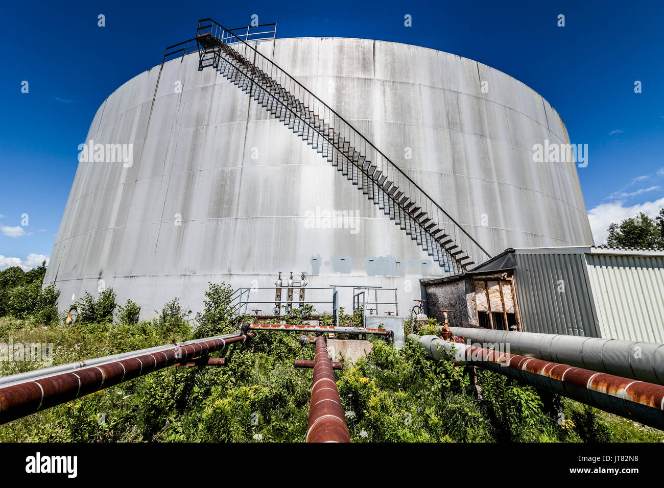 Big Abandoned Oil Refinery Gas Tank and Rusty Pipeline Stock Photo Alamy