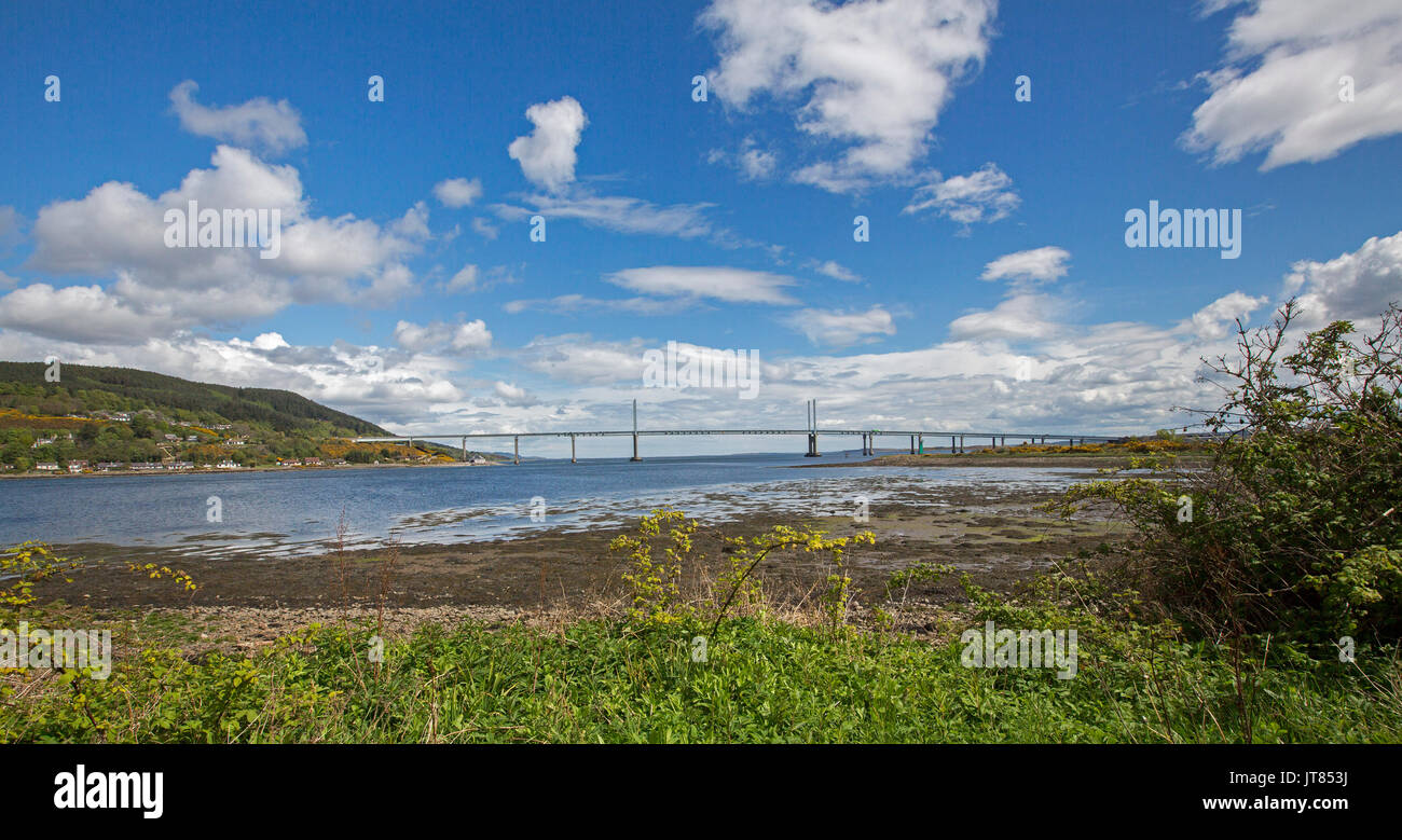 Panoramic view of Kessock bridge over calm blue waters of estuary - Beauly Firth - under blue sky at Inverness, Scotland Stock Photo