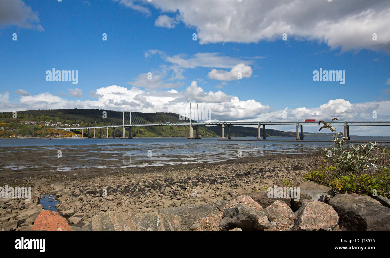 Panoramic view of Kessock bridge over calm blue waters of estuary - Beauly Firth - under blue sky at Inverness, Scotland Stock Photo