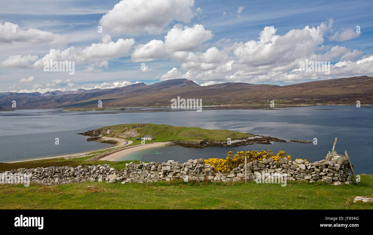 Panoramic view of spectacular highland landscape dominated by Loch Eriboll, 'island' of Ard Neackie, and mountains under blue sky in Scotland Stock Photo