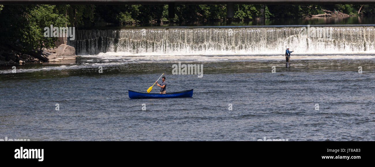 Two men enjoy recreational activities along the Grand River in Southwestern Ontario, Canada. Stock Photo
