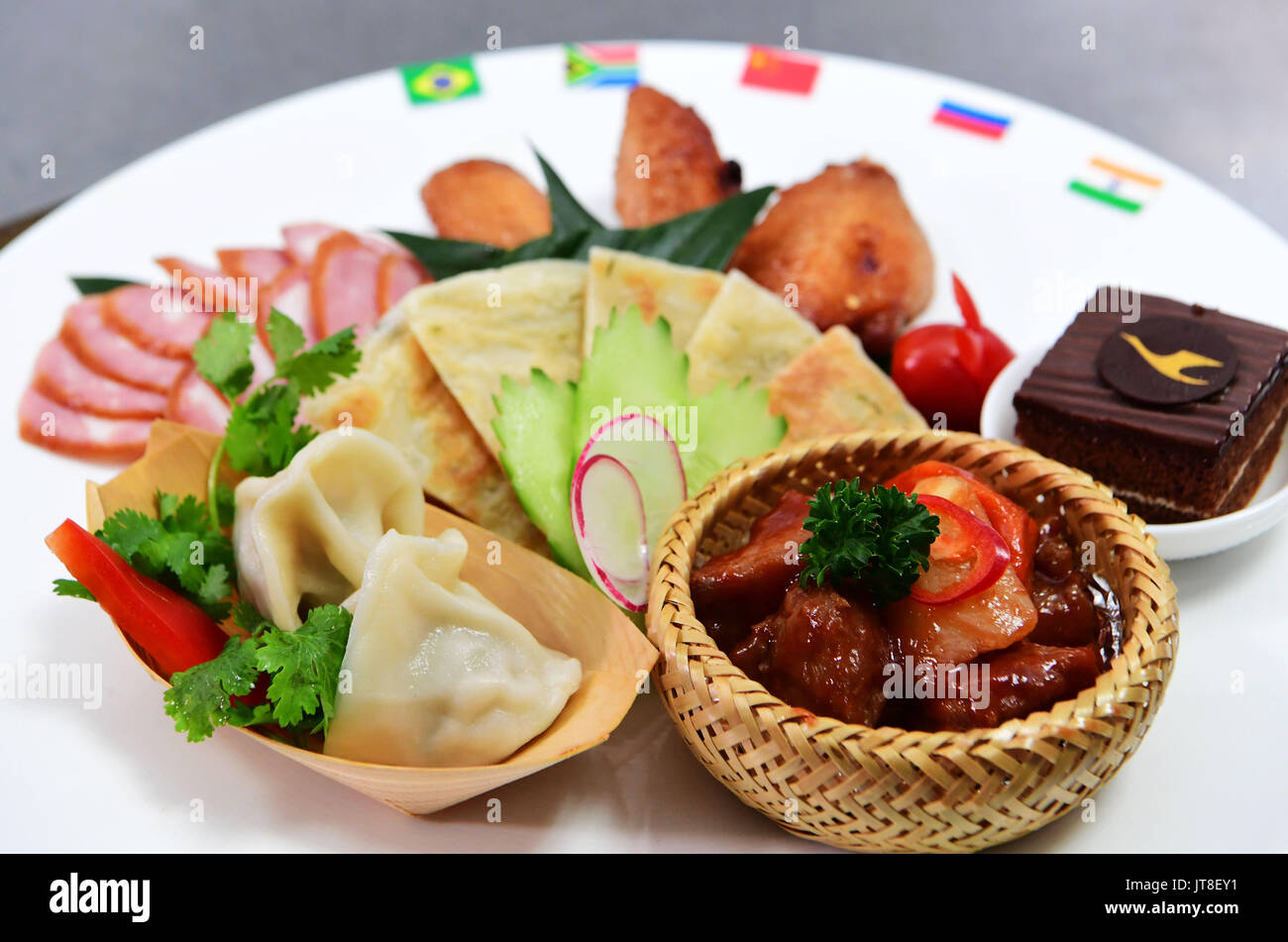 Xiamen. 8th Aug, 2017. Photo taken on Aug. 8, 2017 shows the in-flight meal specially made for the upcoming BRICS Summit during a food festival of Chinese airline XiamenAir in Xiamen, southeast China's Fujian Province. The meal is a mixture of food from five BRICS countries -- Brazil, China, India, Russia and South Africa. In September, China will host the 9th BRICS Summit in the coastal city of Xiamen. Credit: Wei Peiquan/Xinhua/Alamy Live News Stock Photo
